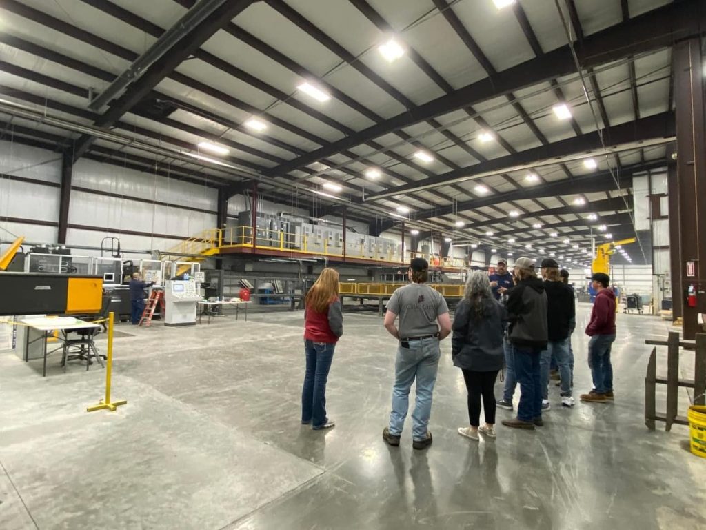 Mizzou Pre-ETS students learning about a factory